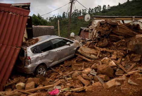 A car and house destroyed by rubble after Cyclone Idai 